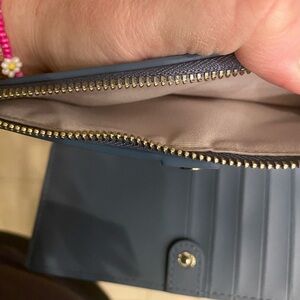 Cornflower Kate spade wallet never used.  Purchased Kate Spade.com